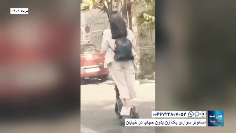 اسکوتر سواری یک زن بدون حجاب در خیابان